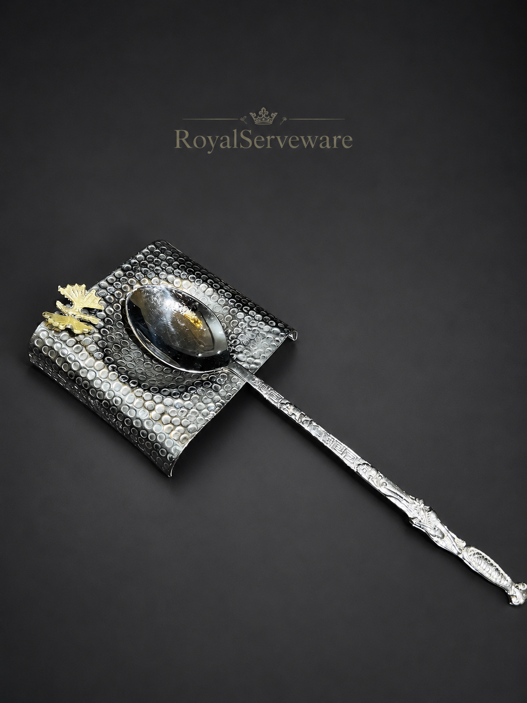 Silver spoon with butterfly spoon rest