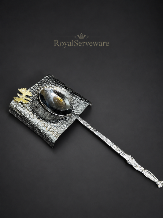Silver spoon with butterfly spoon rest