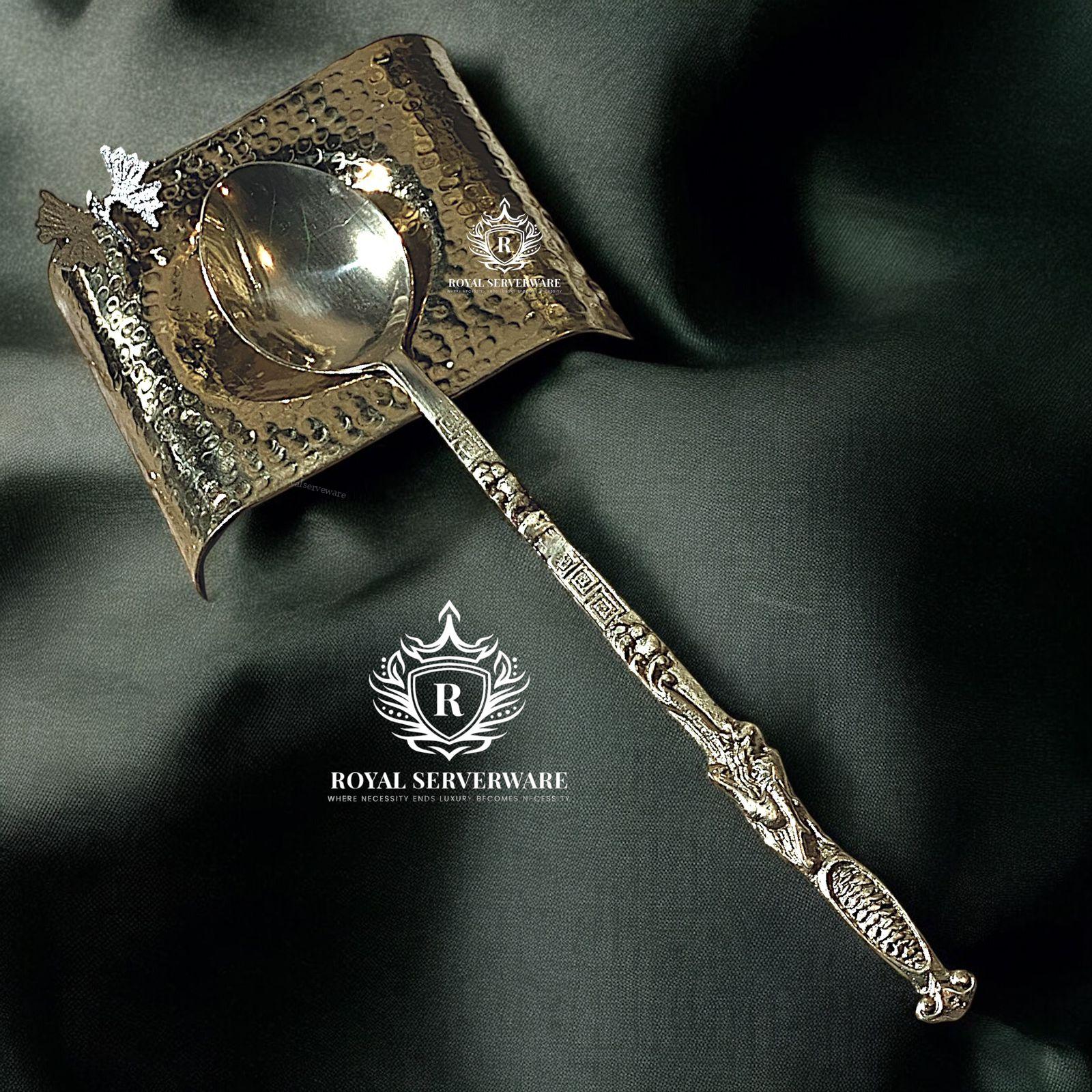 store_01J77NX0SVC6ABY80Q7Z7G43HV_assets_1728937062059-store_01J77NX0SVC6ABY80Q7Z7G43HV2F1728936996812- Silver Spoon / spoon rest - Image 1