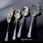 Set of 4 silver serving spoons